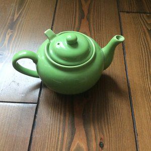 Single serving mini teapot in green with built-in strainer